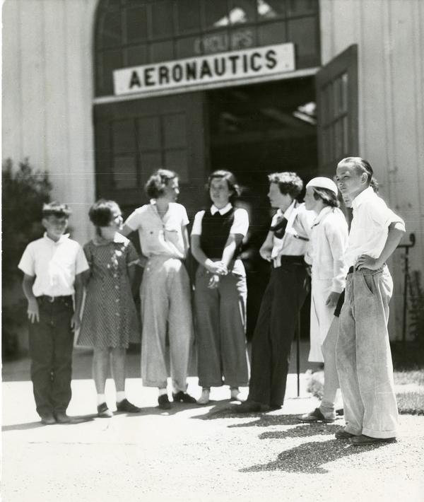 archive photo of Amelia Earhart with students during a visit to Cal Poly